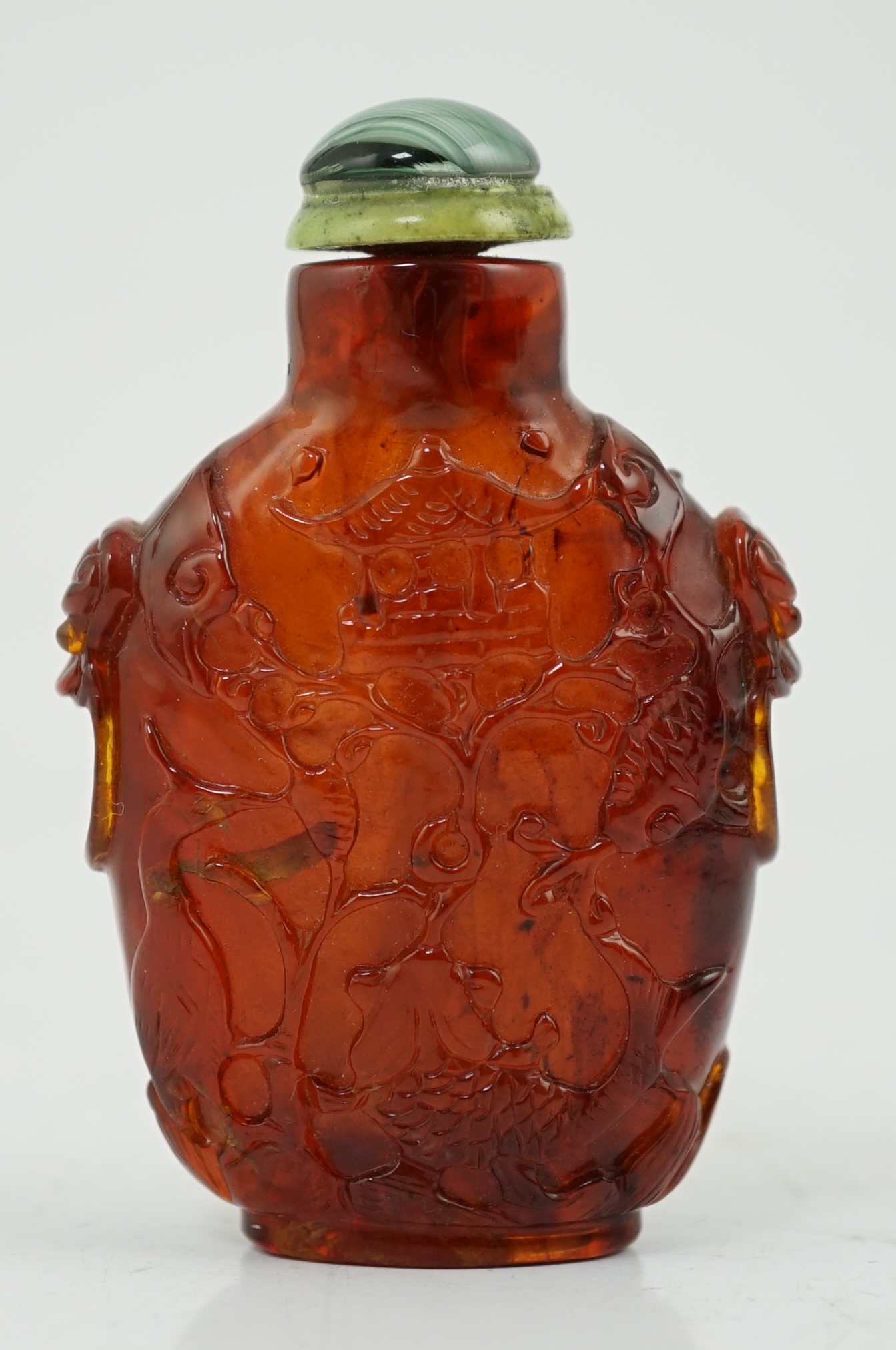 A Chinese carved amber snuff bottle, 19th century